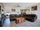 Spacious living room featuring tile floors, a ceiling fan, and ample natural light at 107 Amber Blvd, Auburndale, FL 33823