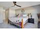 Comfortable main bedroom featuring natural light, plank floors, and decorative ceiling fan at 107 Amber Blvd, Auburndale, FL 33823