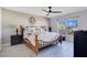 Comfortable main bedroom featuring natural light, plank floors, and decorative ceiling fan at 107 Amber Blvd, Auburndale, FL 33823