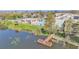 Aerial view of the complex featuring a pier on the lake and a community pool at 1130 N Lake Parker Ave # C328, Lakeland, FL 33805