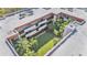 Aerial courtyard view from the building's roof revealing lush landscaping and palms at 1130 N Lake Parker Ave # C328, Lakeland, FL 33805