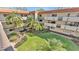 View of landscaped courtyard in a condominium complex with multiple units and balconies at 1130 N Lake Parker Ave # C328, Lakeland, FL 33805