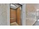 Interior of a residential elevator with wood paneling, metal accents, and adequate lighting at 1130 N Lake Parker Ave # C328, Lakeland, FL 33805