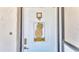 White front door with a decorative pineapple welcome sign and digital lock at 1130 N Lake Parker Ave # C328, Lakeland, FL 33805