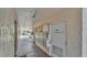 Outdoor condo hallway with a light colored stucco finish and tenant mailboxes at 1130 N Lake Parker Ave # C328, Lakeland, FL 33805