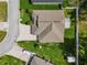 An aerial view of the home showing landscaping, driveway, boat parking, backyard, and privacy fence at 117 Belmont Dr, Winter Haven, FL 33884