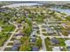 Aerial view of the neighborhood showcasing the home's location near a lake at 117 Belmont Dr, Winter Haven, FL 33884