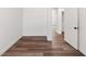 Bedroom with wood floors and bright white walls at 127 Florida Dr, Winter Haven, FL 33881