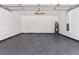 Spacious garage with epoxy floor and water heater at 127 Florida Dr, Winter Haven, FL 33881