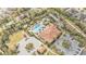 Overhead view of a community clubhouse, swimming pool, cabanas, parking and beautifully landscaped grounds at 1298 Zeek Ridge St, Clermont, FL 34715