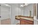 Bathroom featuring granite counters, tile floors and a large mirror at 1298 Zeek Ridge St, Clermont, FL 34715