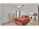 Bedroom featuring carpet flooring, a ceiling fan, and natural light at 1298 Zeek Ridge St, Clermont, FL 34715