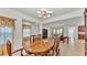 Formal dining room with a chandelier and large dining table, perfect for entertaining at 1298 Zeek Ridge St, Clermont, FL 34715