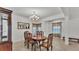 Bright dining room featuring elegant decor, a chandelier, and large window for natural lighting at 1298 Zeek Ridge St, Clermont, FL 34715