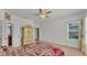 Bright main bedroom with ensuite bath, natural light, and neutral walls at 1298 Zeek Ridge St, Clermont, FL 34715