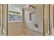 Shower features a window and a handrail with a shower seat at 1298 Zeek Ridge St, Clermont, FL 34715