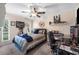 Relaxing bedroom with a ceiling fan, guitar, keyboard, and decorative wall art at 1311 Glengreen Ln, Lakeland, FL 33813