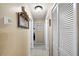 Hallway featuring fresh paint and great closet space, offering practicality and organization throughout the home at 1311 Glengreen Ln, Lakeland, FL 33813