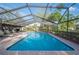 Enjoy the outdoors in this screened-in pool area with ample seating and lush landscaping at 1311 Glengreen Ln, Lakeland, FL 33813