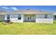 Spacious backyard featuring a covered patio perfect for outdoor entertaining and relaxation at 1588 Leamington Ln, Winter Haven, FL 33884