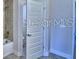 Chic bathroom with a door, shower and tub at 1588 Leamington Ln, Winter Haven, FL 33884