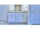 Elegant bathroom featuring double sinks, granite countertop, and stylish cabinets at 1588 Leamington Ln, Winter Haven, FL 33884
