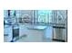 Stylish bathroom featuring modern fixtures and an oversized shower-bath at 1588 Leamington Ln, Winter Haven, FL 33884