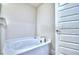 Relaxing bathroom featuring a luxurious bathtub, perfect for unwinding after a long day at 1588 Leamington Ln, Winter Haven, FL 33884