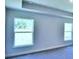 Bright bedroom with ample natural light streaming through two large windows at 1588 Leamington Ln, Winter Haven, FL 33884