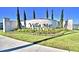 Villa Mar community entrance sign is framed by manicured landscaping, creating an inviting and upscale arrival experience at 1588 Leamington Ln, Winter Haven, FL 33884