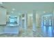 Open-concept living space with abundant natural light and tile floors at 1588 Leamington Ln, Winter Haven, FL 33884