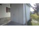 An exterior view shows the utility area of the home with durable siding and functional access at 1610 Reynolds Rd # 239, Lakeland, FL 33801