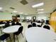 Bright meeting room with tables and chairs, ideal for community events at 1610 Reynolds Rd # 239, Lakeland, FL 33801