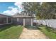 Backyard area featuring an external storage shed and privacy fence at 1722 High Point Dr, Lakeland, FL 33813