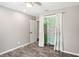 Bright bedroom with a ceiling fan and closet with decorative curtains at 1722 High Point Dr, Lakeland, FL 33813