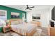 Serene main bedroom featuring neutral tones, ample natural light, and elegant furnishings at 1722 High Point Dr, Lakeland, FL 33813