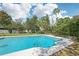 Sparkling in-ground pool with ample space for relaxing and entertaining outdoors at 1722 High Point Dr, Lakeland, FL 33813