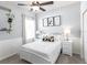 Cozy bedroom features a panda theme, a ceiling fan, and soft natural light from the window at 1728 Burrows Ave, Lakeland, FL 33811