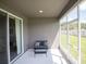 Relaxing screened patio with a small seating area, perfect for enjoying the outdoors at 1728 Burrows Ave, Lakeland, FL 33811