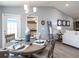 Well decorated dining room adjacent to the living room and kitchen; with seating for four at 1740 Burrows Ave, Lakeland, FL 33811