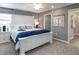 Comfortable main bedroom featuring a large, decorative headboard and stylish, coordinating nightstands at 1740 Burrows Ave, Lakeland, FL 33811