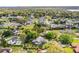 Expansive aerial view of the neighborhood, highlighting the property's location among lush greenery at 1842 Pinnacle Dr, Lakeland, FL 33813