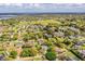 Wide aerial shot showcasing the property's location amidst lush greenery and nearby amenities at 1842 Pinnacle Dr, Lakeland, FL 33813