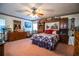 Cozy bedroom featuring built-in shelves, dresser, teddy bears and a quilt-covered bed at 1842 Pinnacle Dr, Lakeland, FL 33813