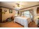 Comfortable bedroom featuring a gold bed frame and decorative floral wallpaper border at 1842 Pinnacle Dr, Lakeland, FL 33813