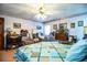 Inviting bedroom showcasing a cozy quilt, ceiling fan, and traditional furnishings at 1842 Pinnacle Dr, Lakeland, FL 33813