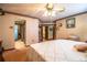 View of a bedroom showcasing the doorway that leads to the bathroom with a shower and vanity at 1842 Pinnacle Dr, Lakeland, FL 33813