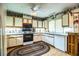 Charming kitchen with white cabinets, an oval rug, and ample storage at 1842 Pinnacle Dr, Lakeland, FL 33813