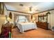 Main bedroom featuring a large bed, a dresser, and a bay window at 1842 Pinnacle Dr, Lakeland, FL 33813