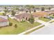 An elevated view of a single-Gathering house with a lush lawn in a residential neighborhood at 2030 Country Manor St, Bartow, FL 33830